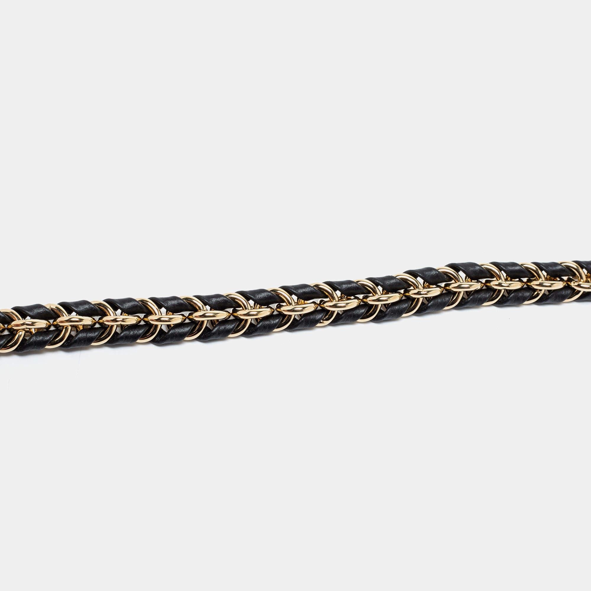 Louis Vuitton's shoulder strap is one of the most useful accessories with a touch of luxury. The creation is a chain link strap woven with black leather and is complete with two gold-tone clasps for you to attach it to your bags.

