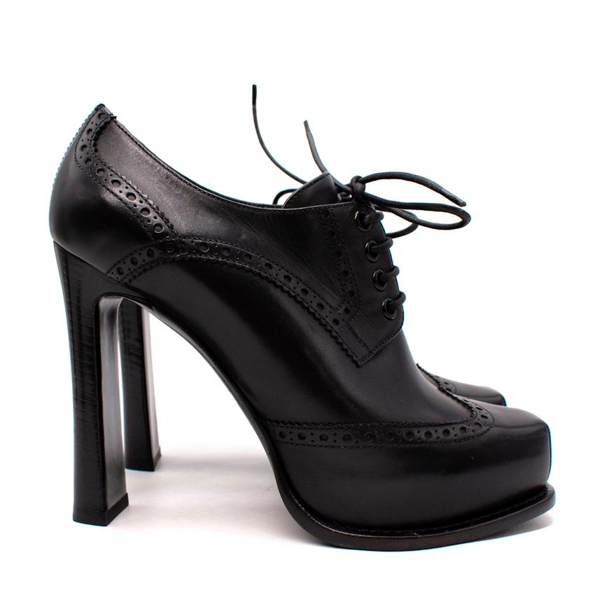 Louis Vuitton Black Brogue Leather Derby Heeled Booties
 

 - Square toe, platform sole heeled booties with traditional broguing detail 
 - Lace front
 - Set on a high block heel
 

 Materials 
 100% Leather 
 

 Made in Italy 
 

 PLEASE NOTE,