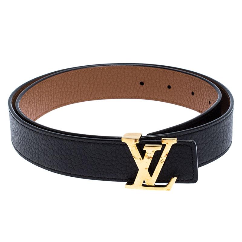 This Louis Vuitton belt has been crafted to a sleek and seamless finish. Made from leather, it features the polished LV logo buckle in gold-tone metal and loop holes for an adjustable fit. Its reversible feature allows you to wear it in black or