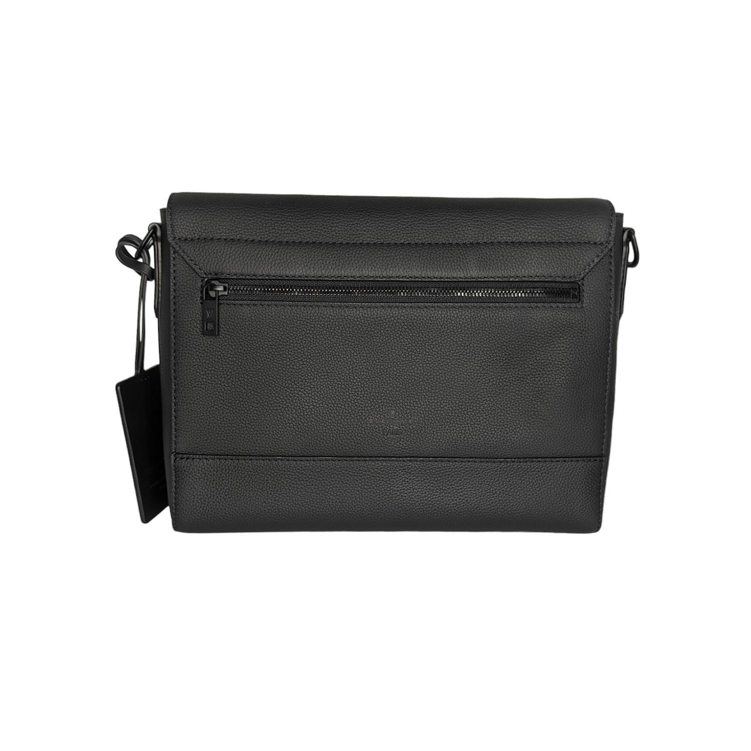 This chic messenger bag is crafted of black grained calfskin leather. The bag features a full front flap with black hardware LV on the bottom corner, a rear zipper pocket, black cowhide leather trim and a long canvas crossbody strap with black