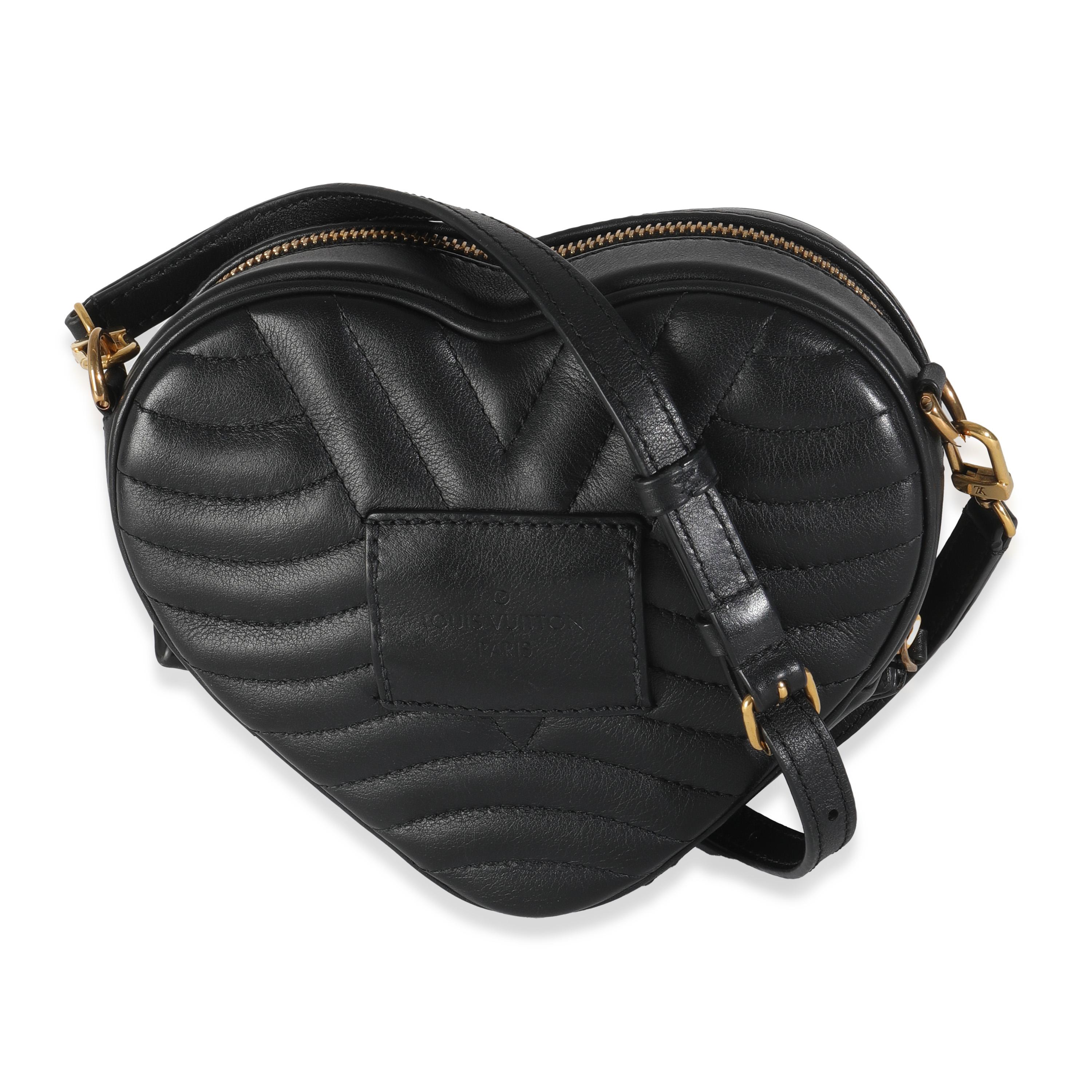 Listing Title: Louis Vuitton Black Calfskin New Wave Heart Bag
SKU: 144623
Condition: Pre-owned 
Condition Description: Make waves in the style department with the New Wave bag from Louis Vuitton. A chunky logo adorns the front, while curved