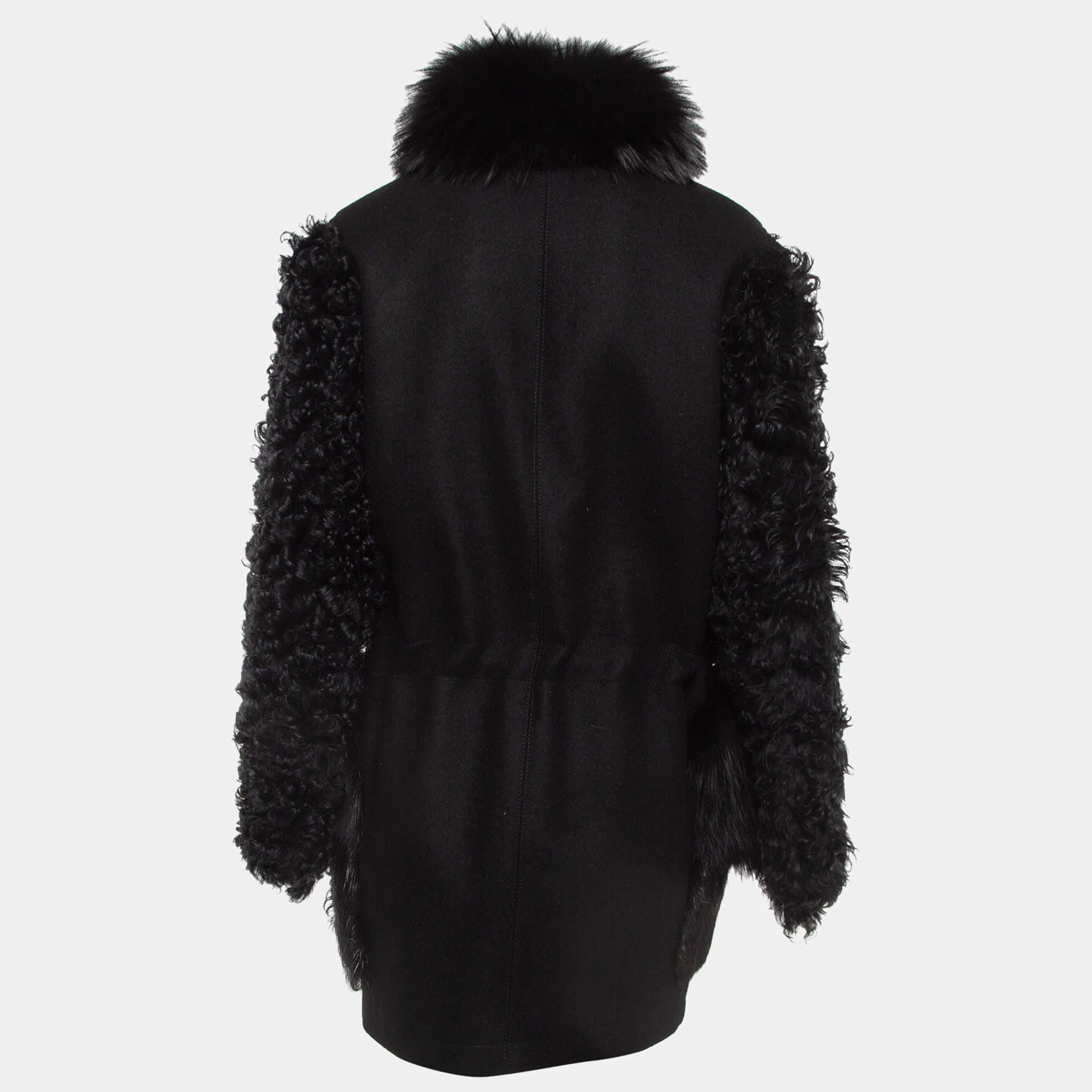 Crafted from compact cashmere and fur, this easy-but-chic outerwear piece perfectly blends luxury and functionality. Embellished with beaver, shearling, and fox patchwork pockets, a fox collar, and sleeves in black shearling, it can be cinched at