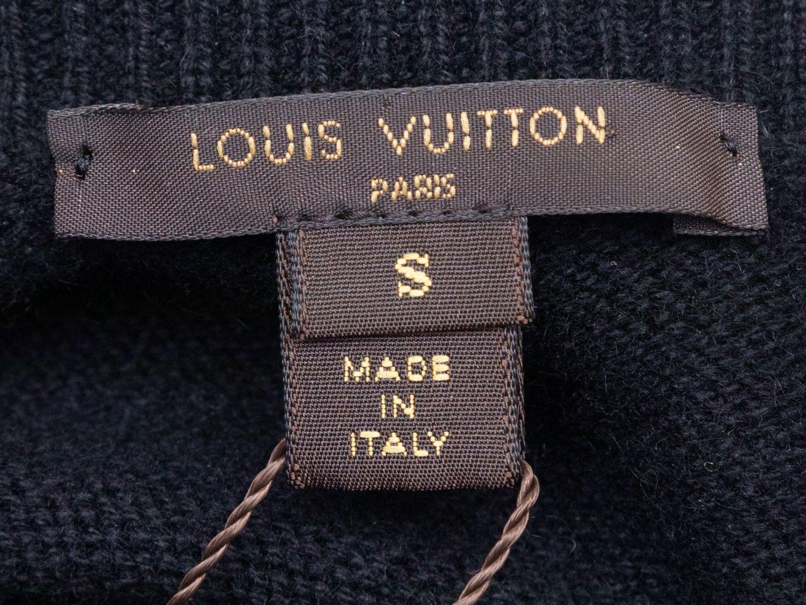 Product Details: Black cashmere sweater dress by Louis Vuitton. Crew neck. Short sleeves. Silver-tone bead detailing at front bodice. 34