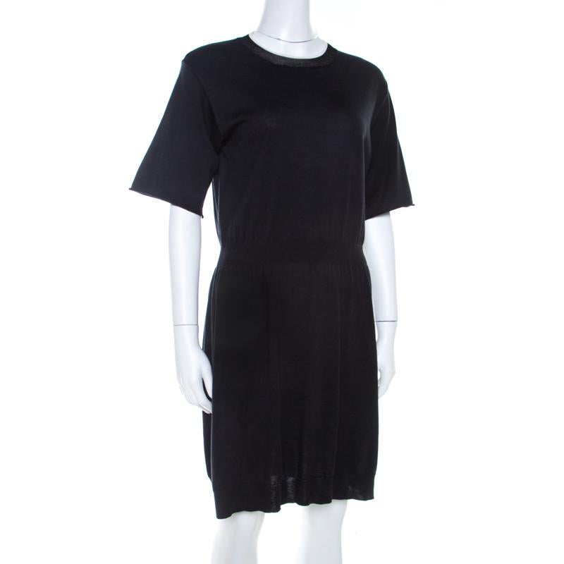 From the house of Louis Vuitton, this dress is a lovely creation. It features an elasticized waist, short sleeves and a crew neckline. This comfortable black dress can be worn with sneakers or flat sandals.

Includes: The Luxury Closet