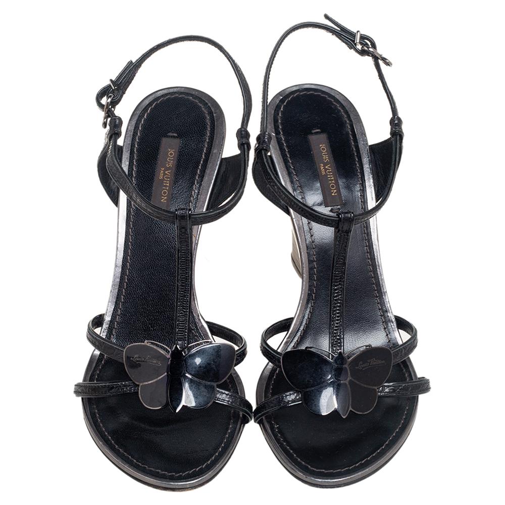 These sandals from Louis Vuitton are creatively made to offer your feet with nonpareil style. Crafted using black croc-embossed leather on the upper with a butterfly applique perched on the front, these sandals display a chic, elegant silhouette