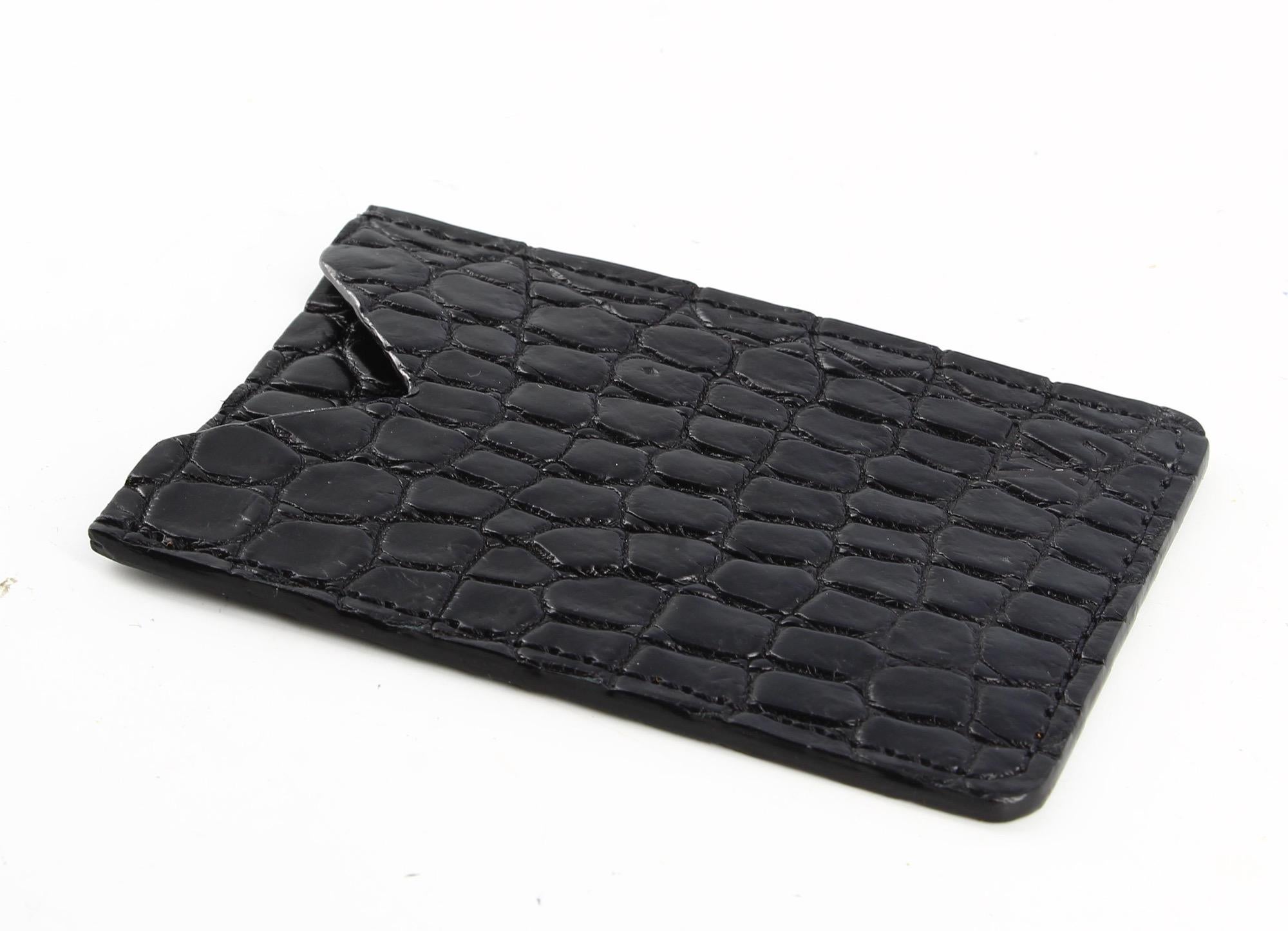 Louis Vuitton Black Croco Leather Card Case

- Good condition, shows slight traces of wear over time.
- Louis Vuitton black card case
- LV logo on the bottom right of the front
- Interior: Black croco leather
- Packaging: Opulence luxury vintage