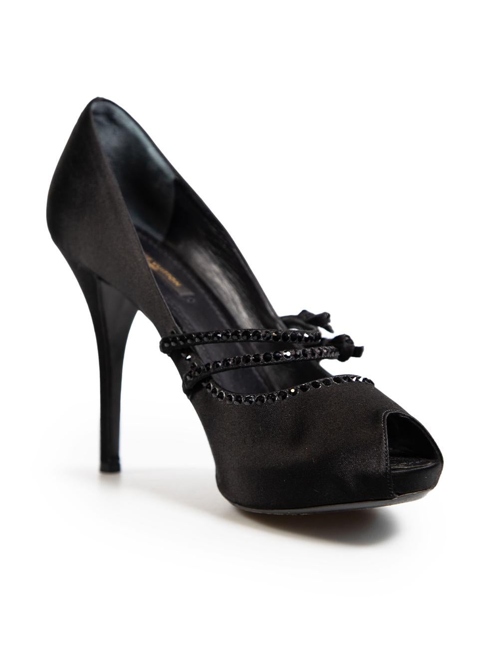 CONDITION is Very good. Minimal wear to heels is evident. Minimal wear to heel stems with light scratches to both shoes, abrasion to the left side of the outsole on the right shoe. The bows on the right shoe are loose on this used Louis Vuitton