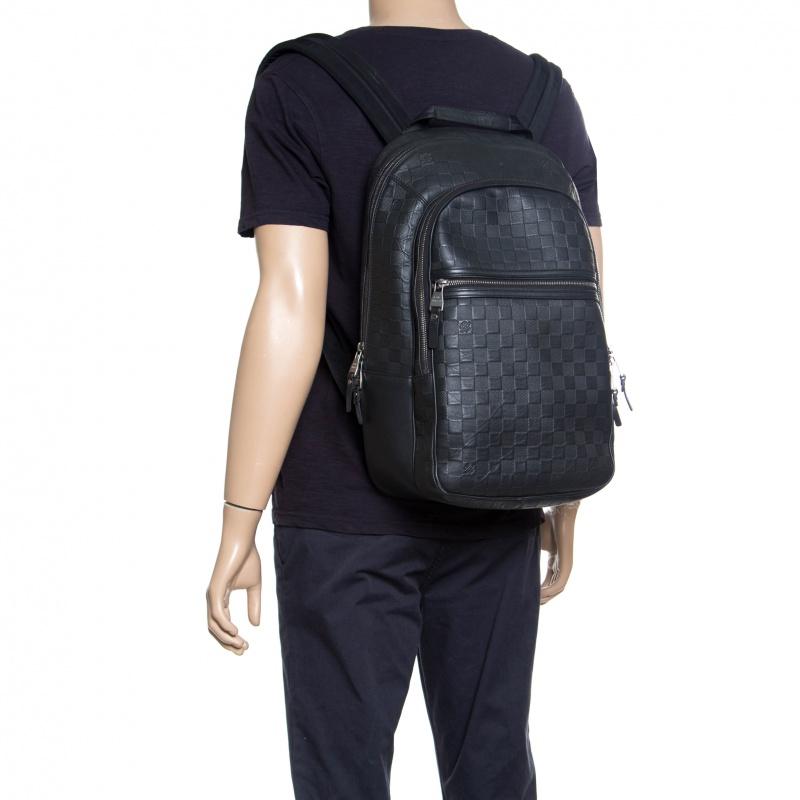 Say hello to this luxurious piece from Louis Vuitton. The backpack has been crafted from Damier Infini leather and designed with multiple zip compartments, shoulder straps, and a top handle. This functional piece is perfectly made to carry your