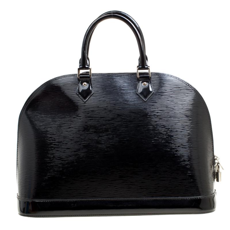 A classic from the house of Louis Vuitton, the shape of the Alma stands out. Louis Vuitton Alma was named after the Alma Bridge that connects Paris's fashionable neighborhood. Made from signature Epi leather the bag features a beautiful black