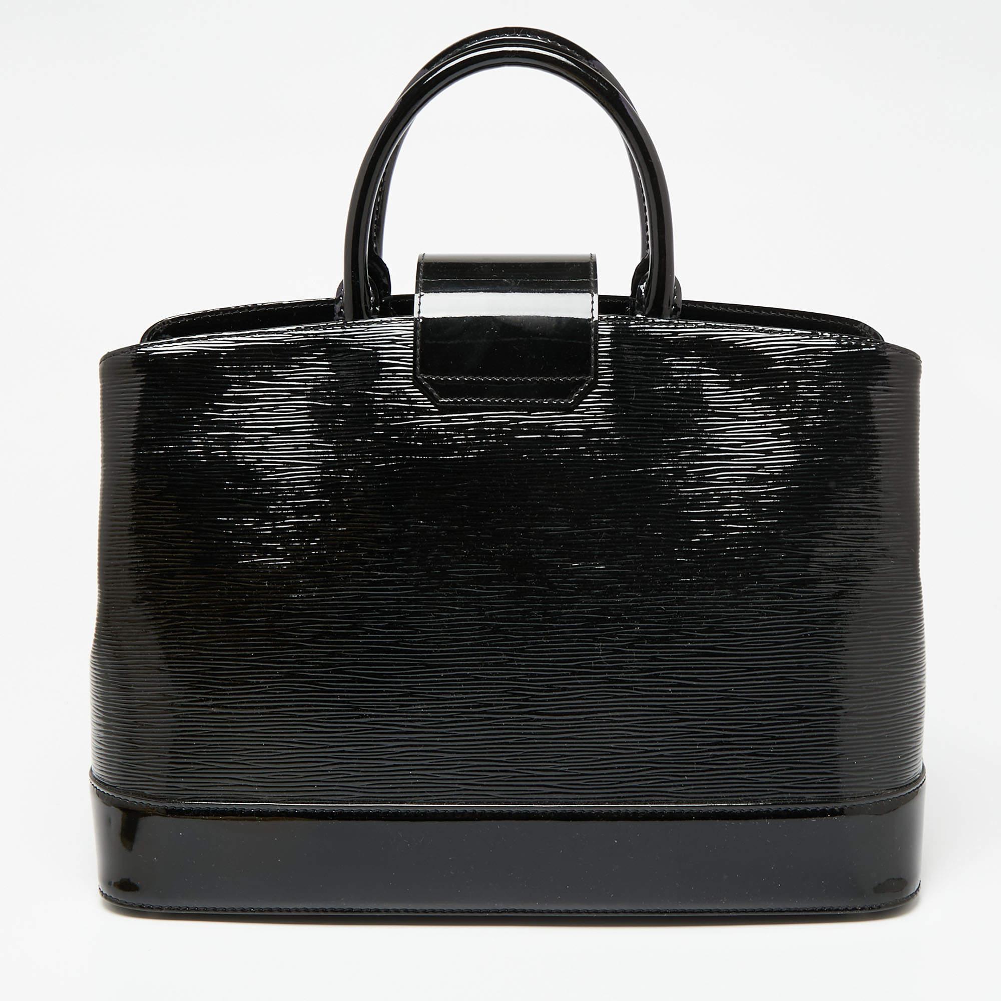 Enriched with striking elements, this Louis Vuitton Mirabeau bag signifies classic allure and elevated design. The silver-tone accents against the black body offer it an elegant contrast, and it is added with a branded lock closure for a