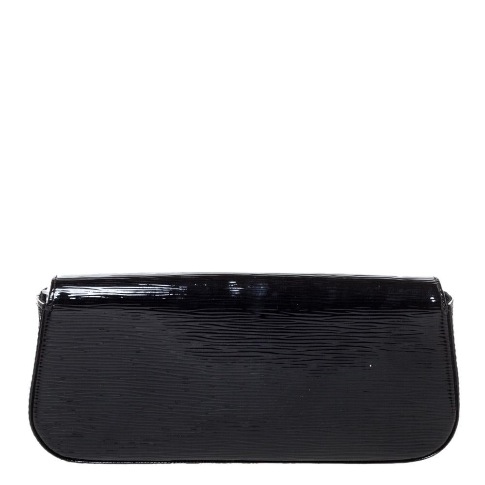 Well-crafted and overflowing with style this Sobe clutch is from Louis Vuitton. It has a patent epi leather exterior, a fabric interior, and a large LV adorned on the flap. This creation will lift all your gowns and elegant outfits.