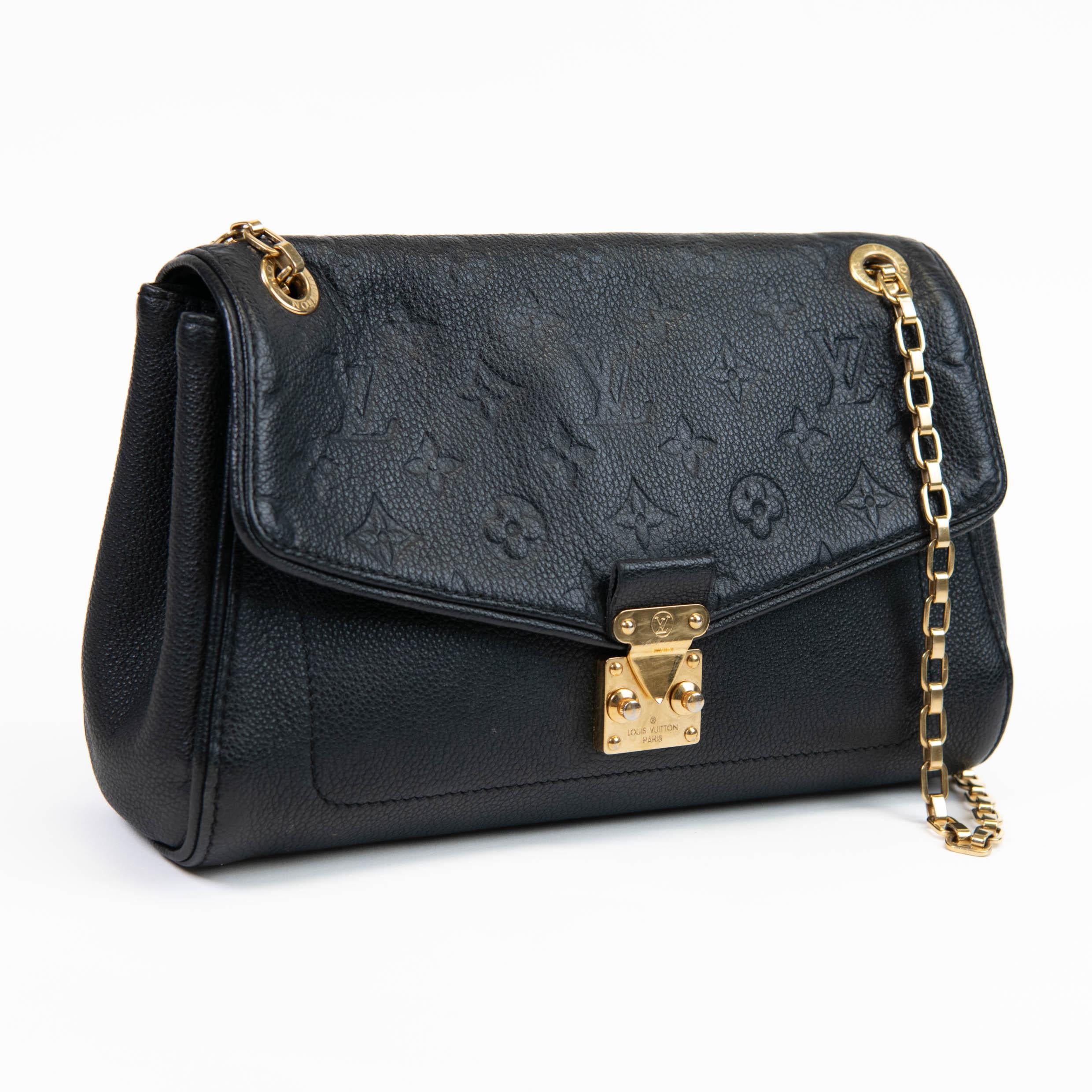 100% Authentic 

 This beautiful flap style shoulder bag is crafted of Louis Vuitton monogram embossed leather in black. The bag features brass bijoux chain link shoulder straps with a cross-over flap and a polished brass press lock. The flap opens