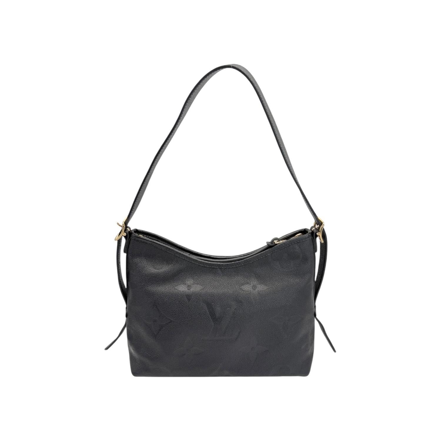 Indulge in luxury with the Louis Vuitton Black Monogram Giant CarryAll PM. Crafted from supple, grained leather and detailed with gold-tone hardware, this designer bag exudes elegance and sophistication. The spacious interior, zip closure, and