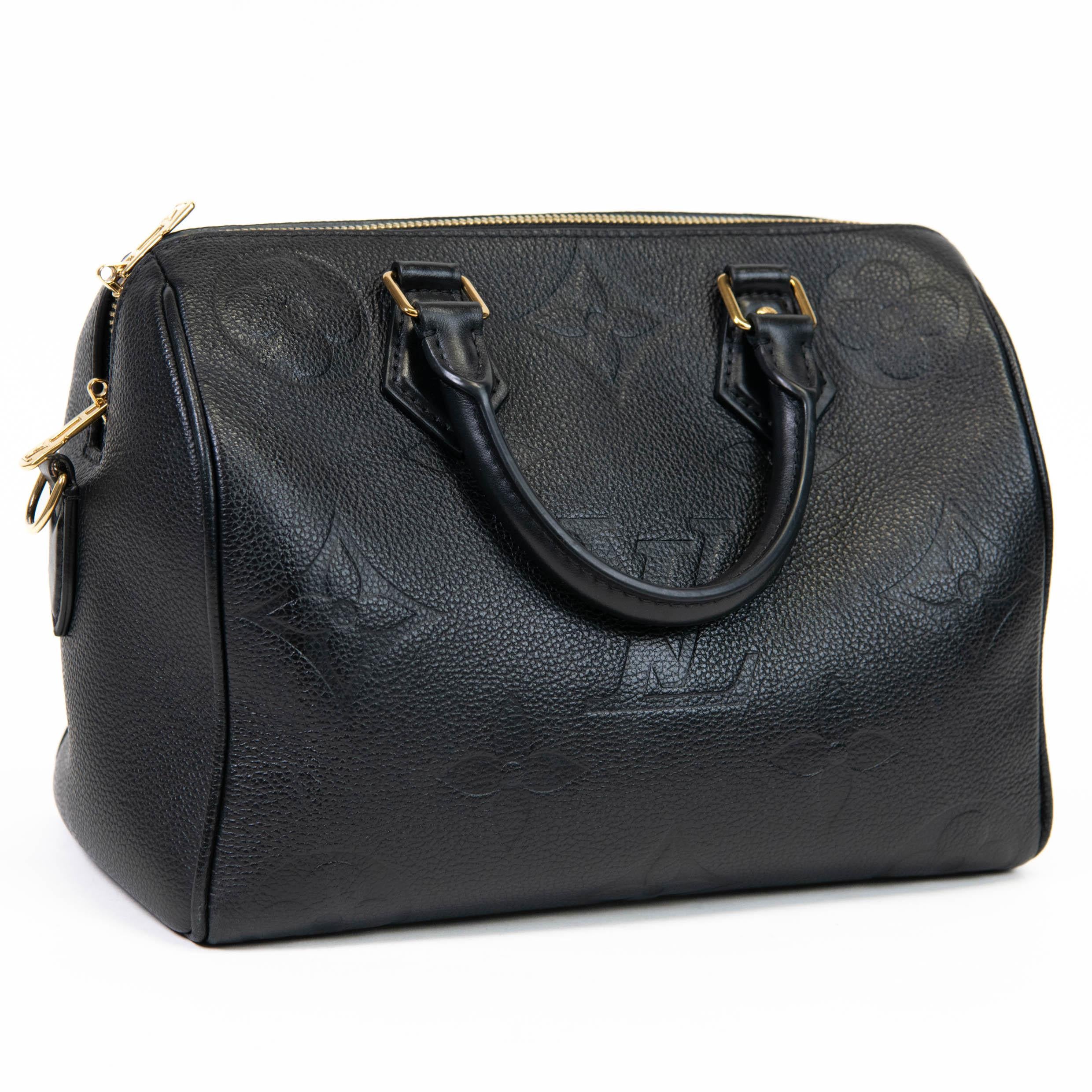100% Authentic 

This classic tote is crafted of oversized empreinte in black. The crossbody bag features rolled leather top handles, and an optional, adjustable shoulder strap with polished gold hardware. The top zippers open to a black microfiber
