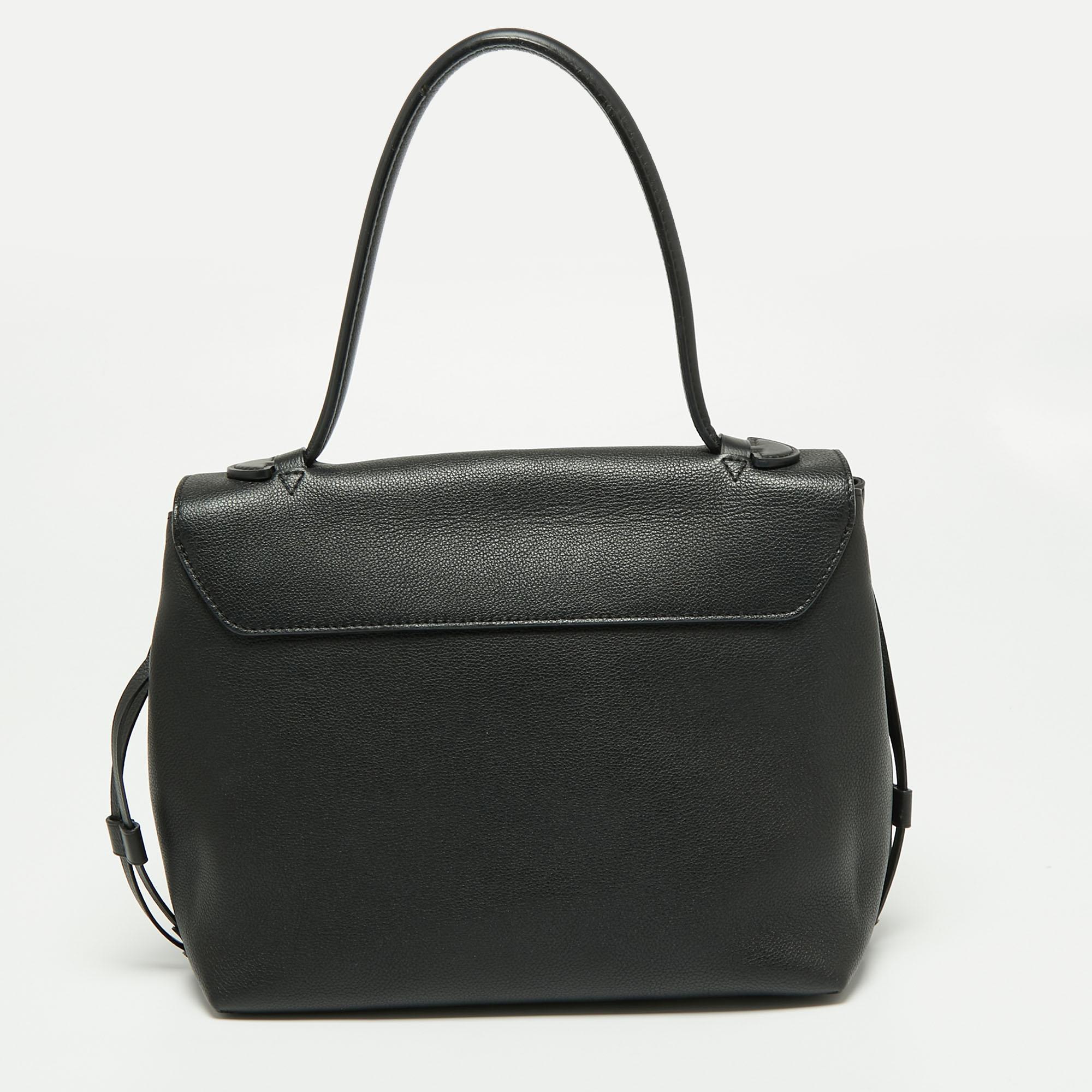 For years, women have leaned towards Louis Vuitton's handbags when it comes to powering their personal style. This Lockme MM bag, like all the other handbags, is durable and stylish. Crafted from luxe leather, it comes with a single top handle and a