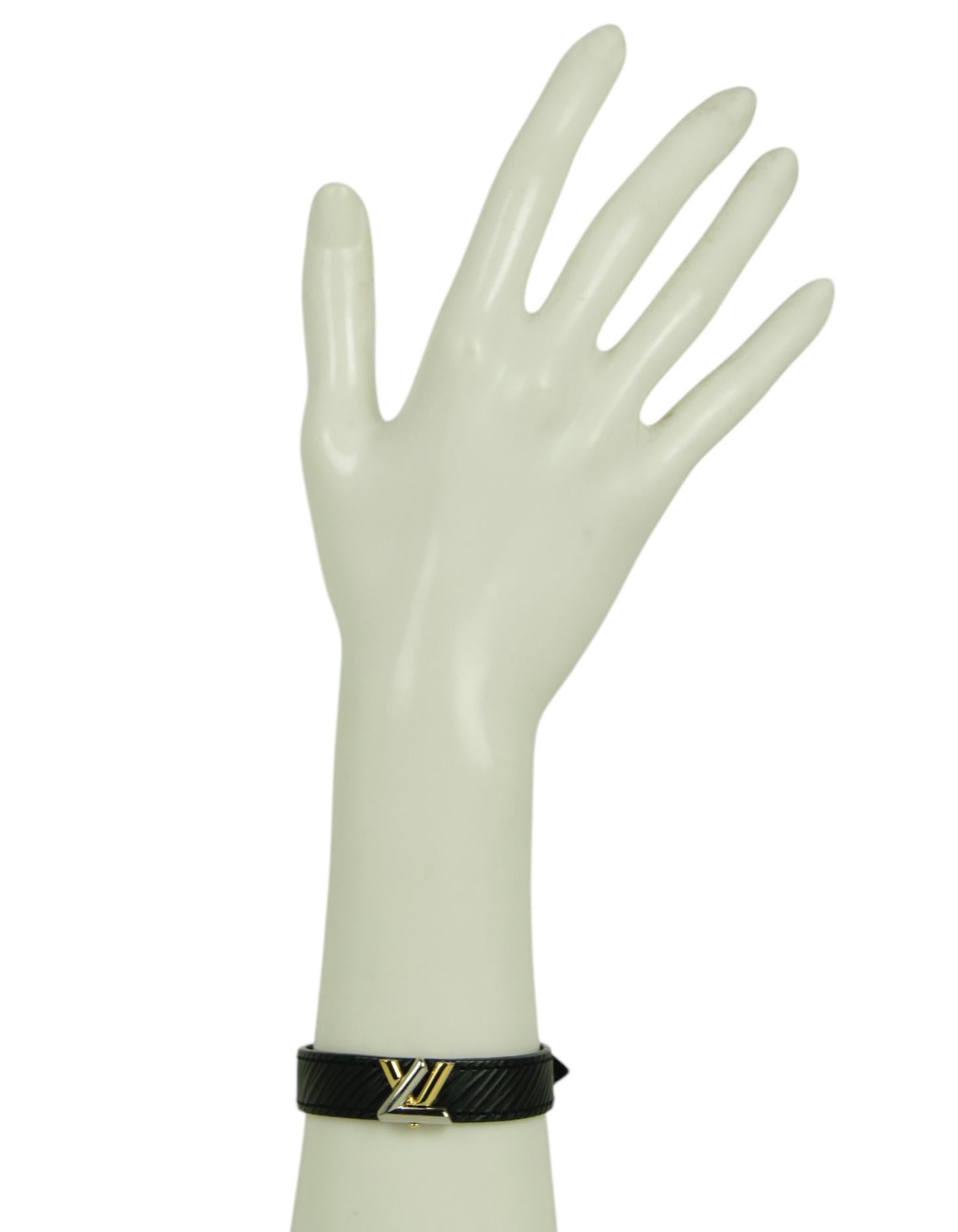 Louis Vuitton Black Epi Leather Gold/Silver Twist Bracelet 

Made In: Spain
Color: Black with gold and silver hardware
Materials: Epi leather
Closure/Opening: Snap
Overall Condition: Excellent condition
Includes: LV box and pouch

Measurements: sz