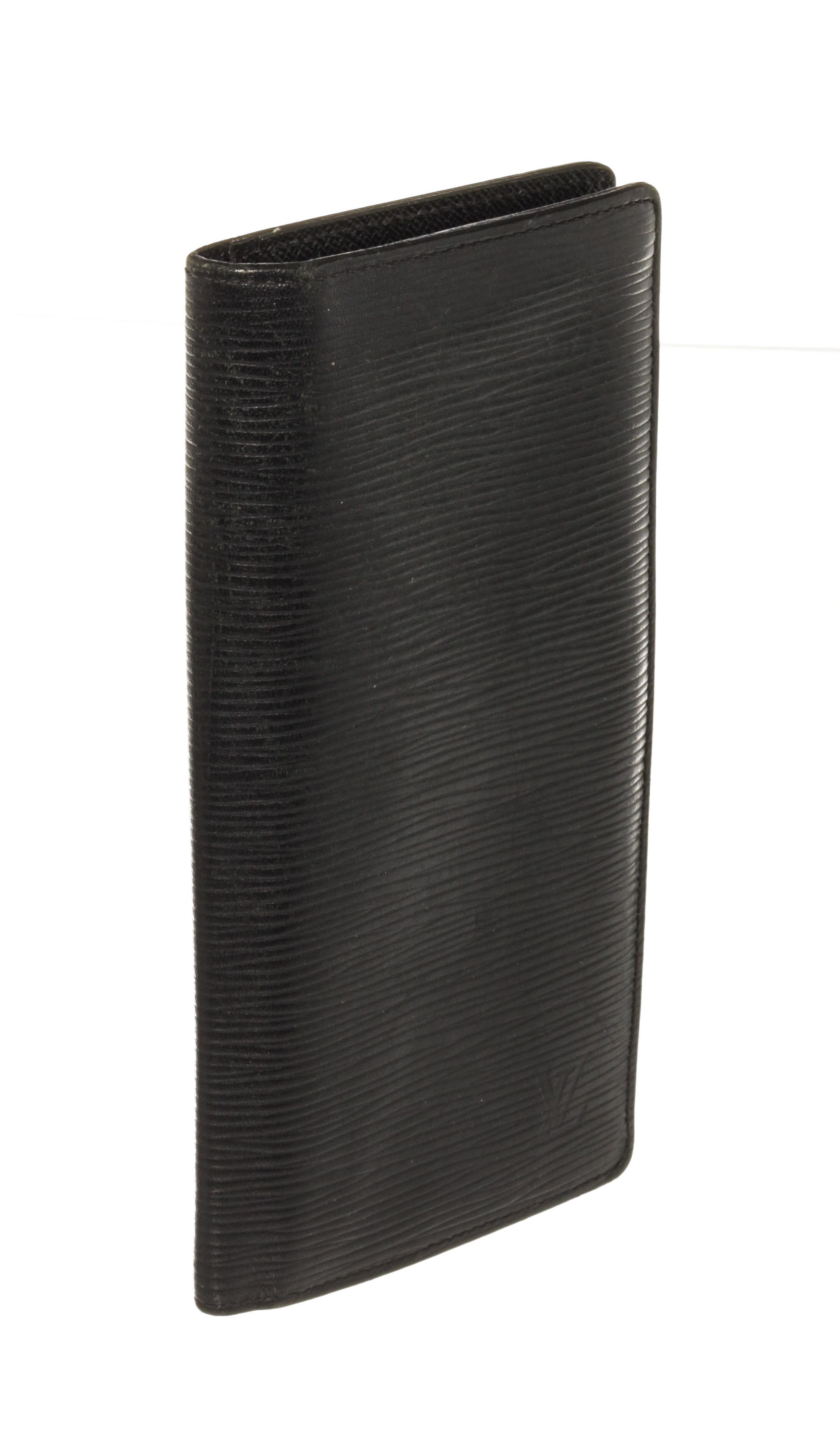 Louis Vuitton Black Epi Leather Brazza Wallet with black leather trim, black taiga leather lining, and silver-tone hardware. 

440104MSC