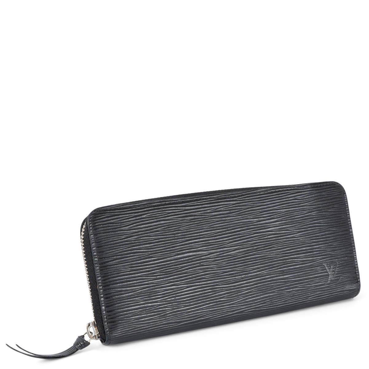 100% authentic Louis Vuitton Clemence wallet in black Epi leather featuring silver-tone hardware. Opens with a zipper on top and eight credit card slots, two bill compartments and a zipped coin pocket in the middle. Has been carried and is in
