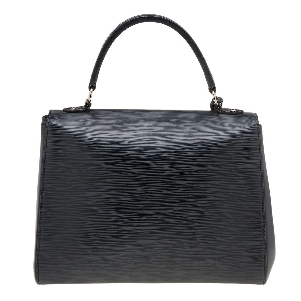 Each bag that comes out of Louis Vuitton's workshops carries the brand's history of classic allure and faultless craftsmanship, including this beauty. Created from their Epi leather, the Cluny bag has a fine finish. The bag features a top handle, a