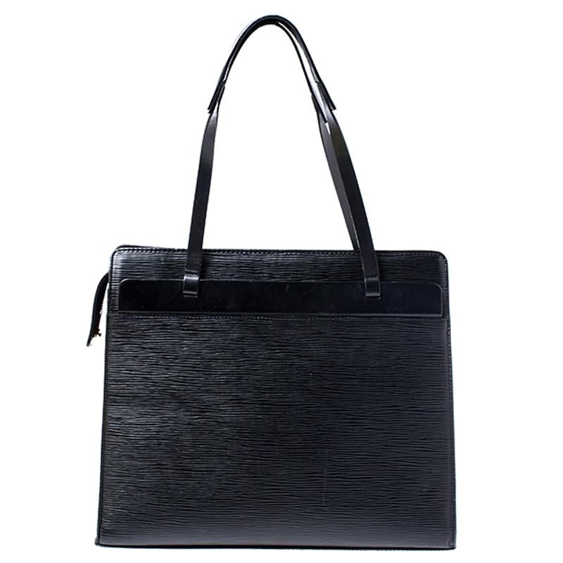 Arrive in style at your office by carrying this Croisette PM tote from Louis Vuitton made from black Epi leather. This messenger bag will keep all your documents safe with the help of zipper on the top and also has enough space for many more things