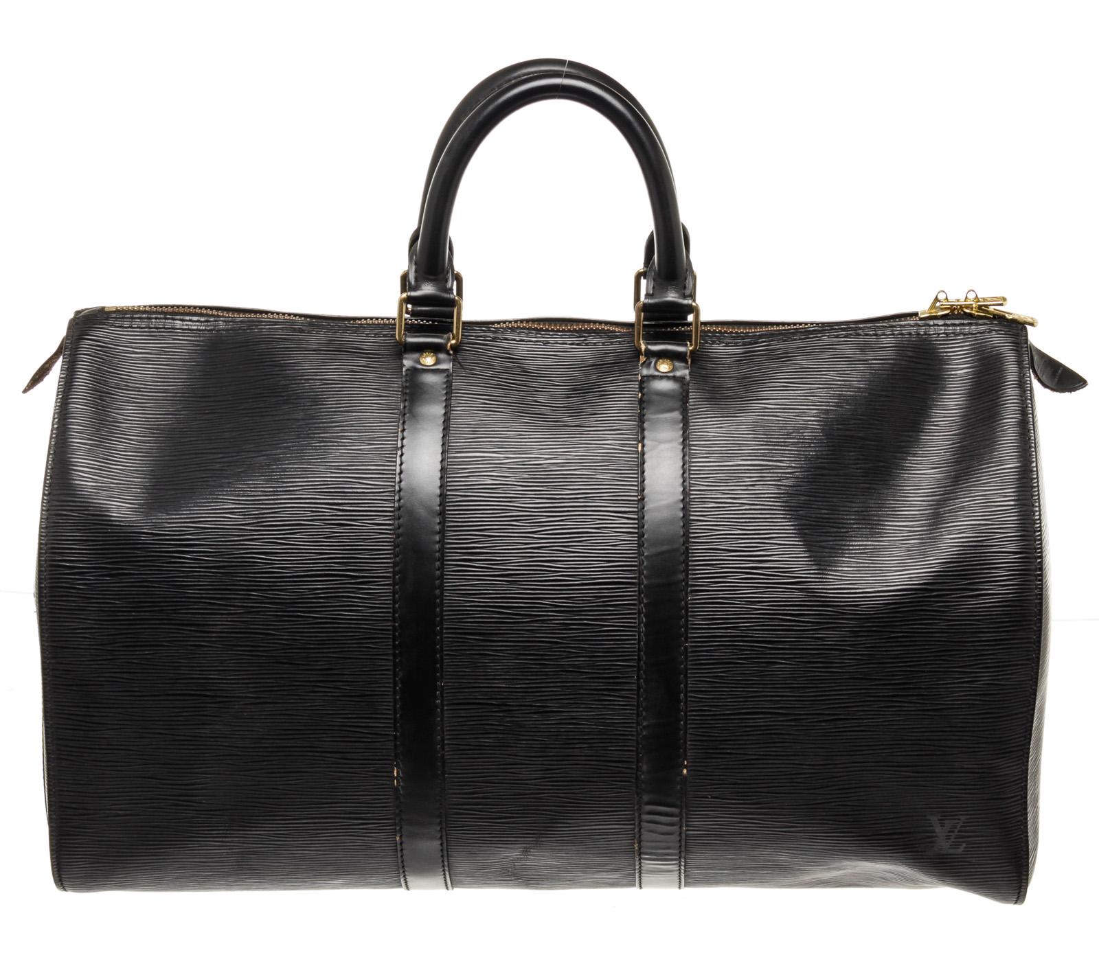 Louis Vuitton Black Epi Leather Keepall 45cm Travel Bag with epi leather, silver-toneÂ hardware, trim tan vachetta leather, dual top handle, adjustableÂ shoulder strapÂ and zipperÂ closure.

50908MSC
