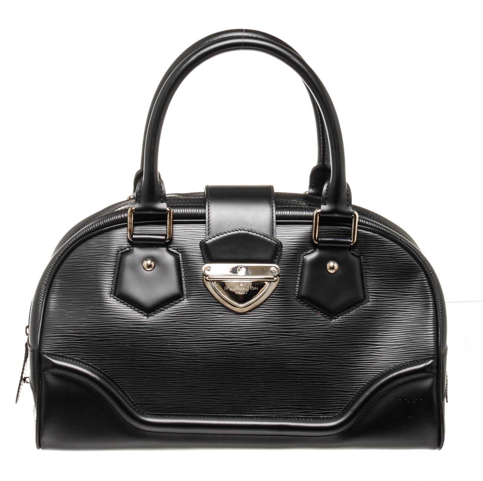 Louis Vuitton Black Epi Leather Montaigne GM Shoulder Bag with flap zip top closure. Interior is canvas lined with side slip pocket.

49107MSC