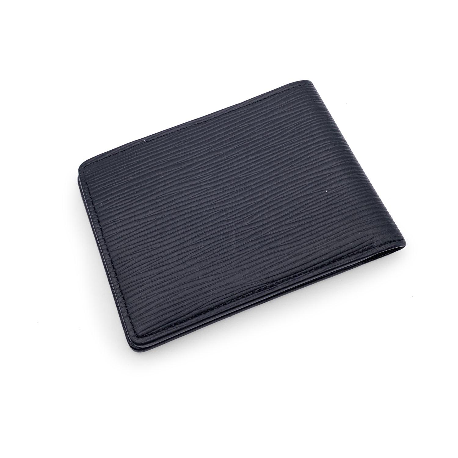 This beautiful wallet will come with a Certificate of Authenticity provided by Entrupy. The certificate will be provided at no further cost Louis Vuitton black epi leather Multiple Bifold Wallet Credit Card Holder. Bifold design. 2 bill