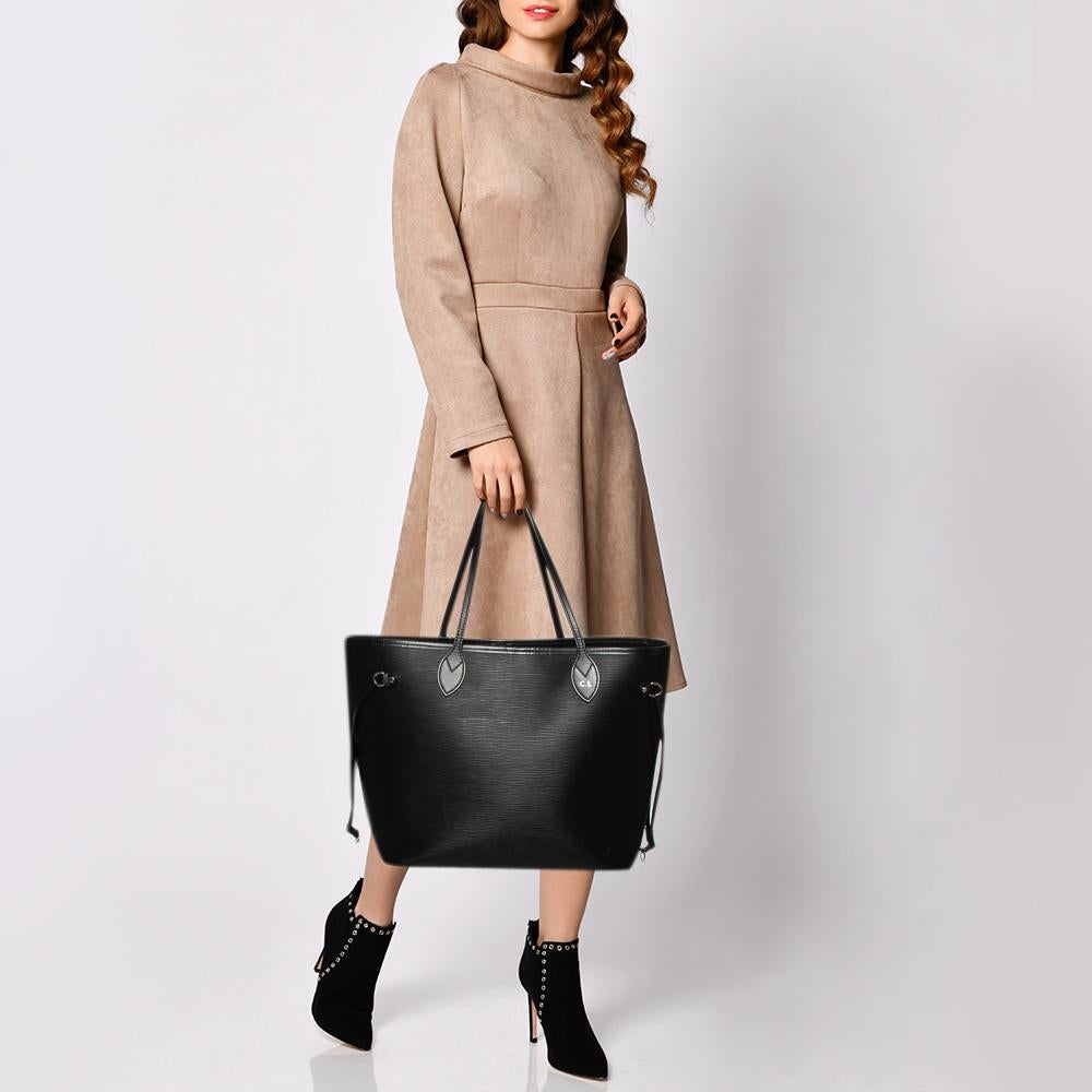 Louis Vuitton’s Neverfull was first introduced in 2007, and even today, it is a popular design. Crafted from Epi leather, this bag is gorgeous in appeal. It has drawstrings on the sides for the desired frame, a spacious Alcantara-lined interior that