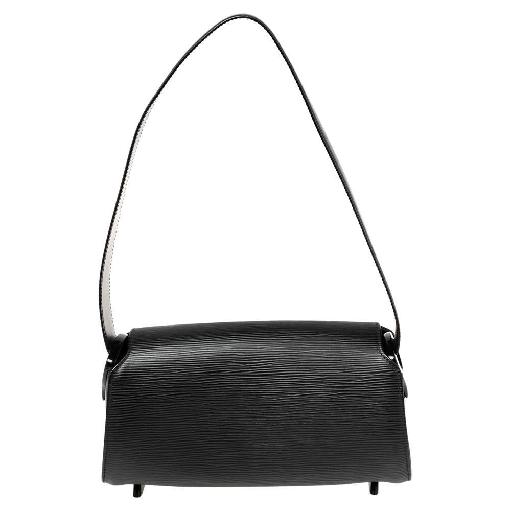 Expertly designed, this Louis Vuitton Nocturne PM bag is a thing of beauty. Crafted from Epi leather, it comes in a classy shade of black. It is lined with Alcantara and held by a single handle.

Includes: Original Dustbag