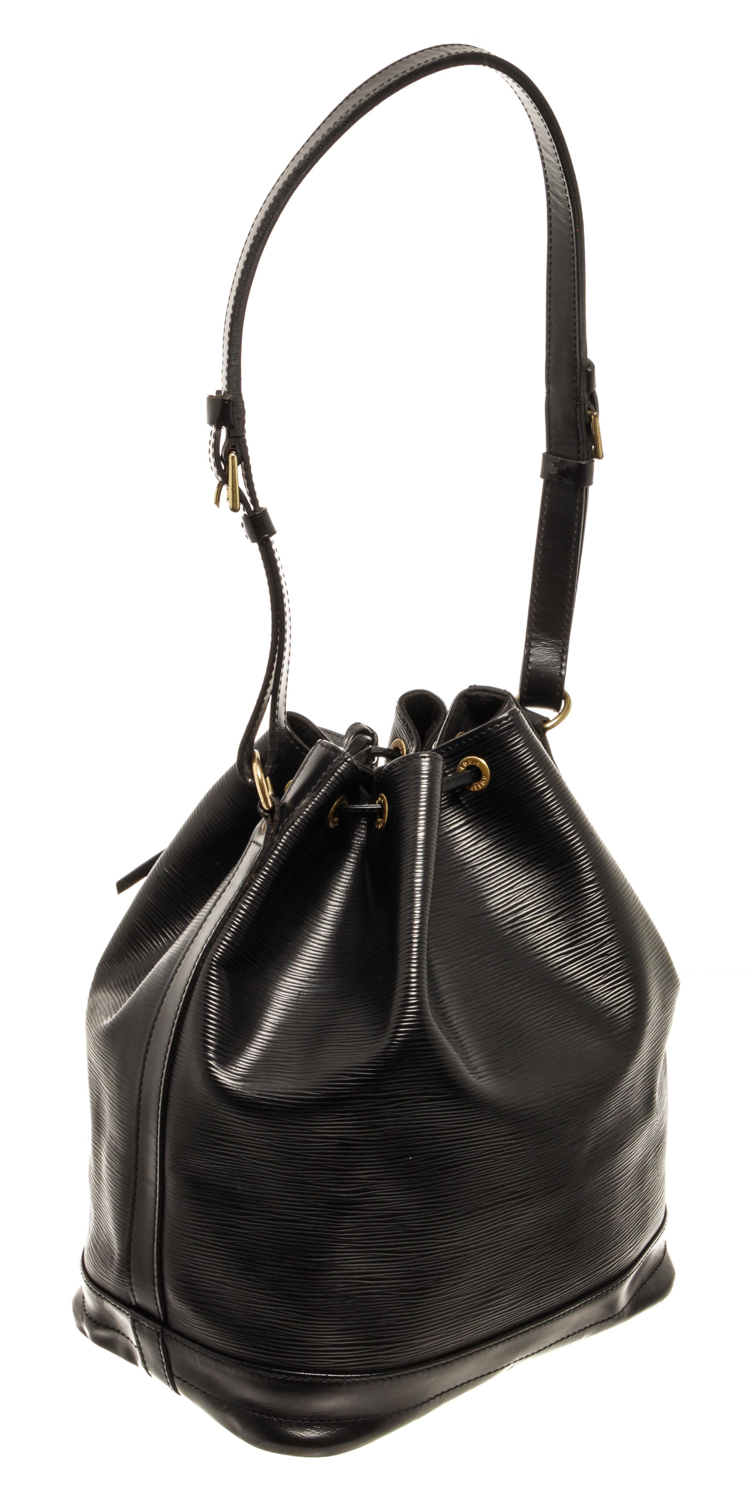 Louis Vuitton Black Epi Leather Noe with adjustable strap, suede lining, drawstring closure, gold tone hardware.

76927MSC