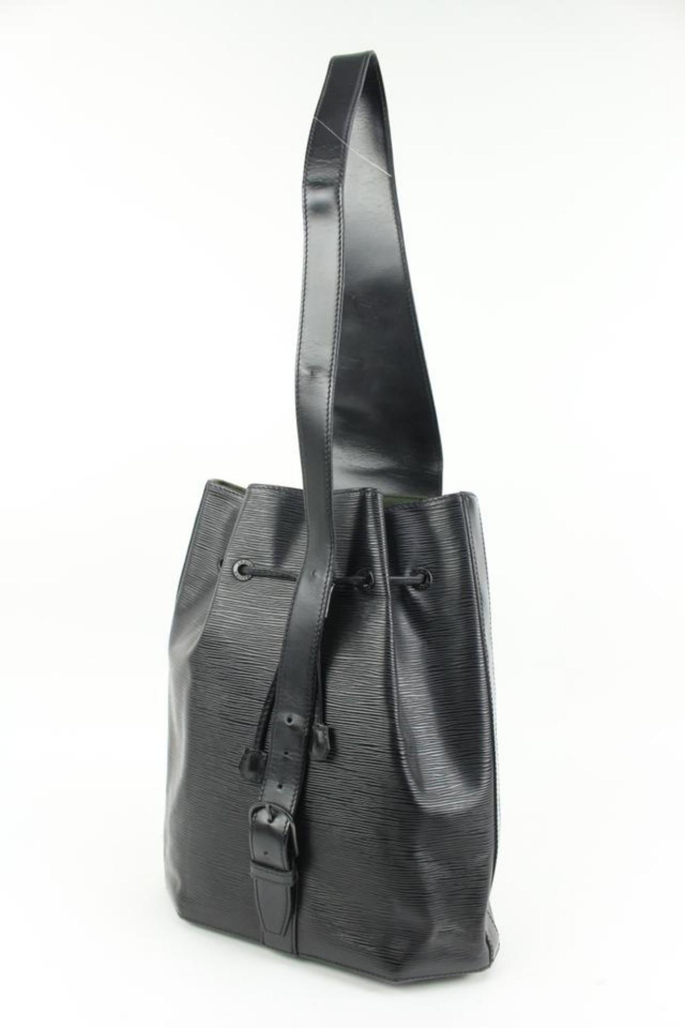 Louis Vuitton Black Epi Leather Noir Sac a Dos Sling Backpack 41lk324s
Date Code/Serial Number: VI1921
Made In: France
Measurements: Length:  14