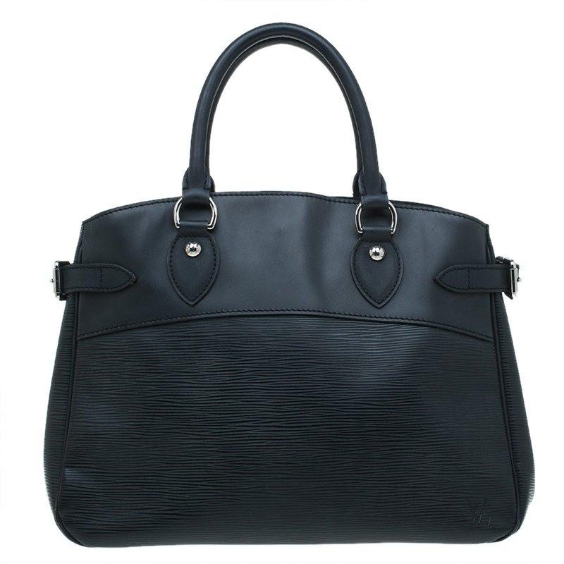 Accent a work outfit with this Louis Vuitton Passy PM satchel. It is made from Louis Vuitton's epi leather with a black leather trim and features side buckle detailing and rolled leather handles. The interior is lined with fabric and comes with a