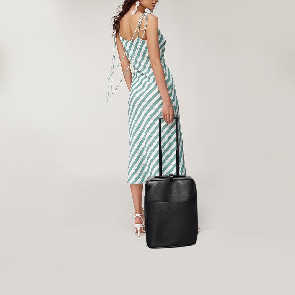 Say hello to your new traveling partner from Louis Vuitton. The exterior has been crafted from Epi leather while the spacious interior is lined with nylon. Equipped with a compartment at the front, sturdy handles, two wheels, and a telescopic cane,