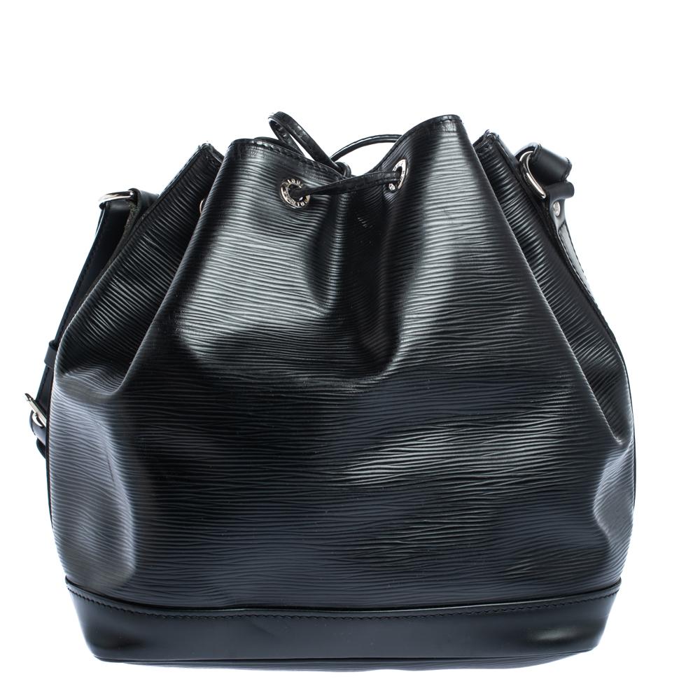 Created in 1932 by Louis Vuitton to carry bottles of Champagne, the iconic Noe now serves as a stylish daytime handbag. Crafted from black Epi leather, the bag exudes just the right amount of sophistication. It has a single adjustable strap with