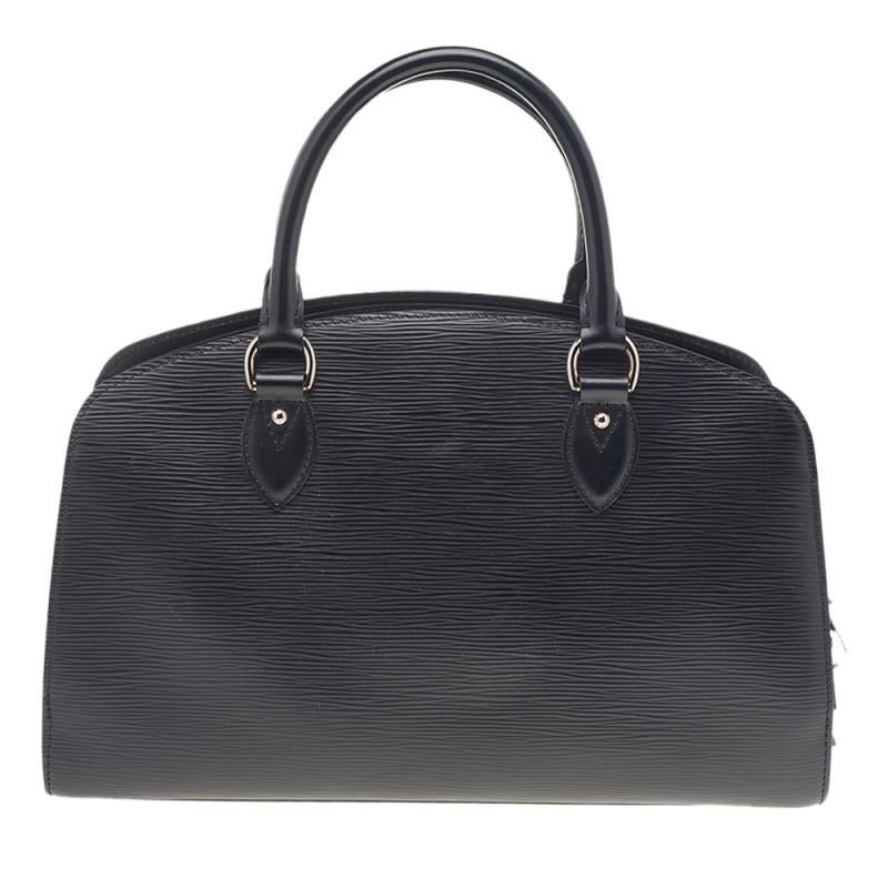Pont Neuf is a notable descendant of Louis Vuitton’s classic 'Steamer'. Rendered in a sturdy silhouette, this bag is crafted from black Epi leather, and features top rolled handles and a structured silhouette. It is further secured by a top zip that