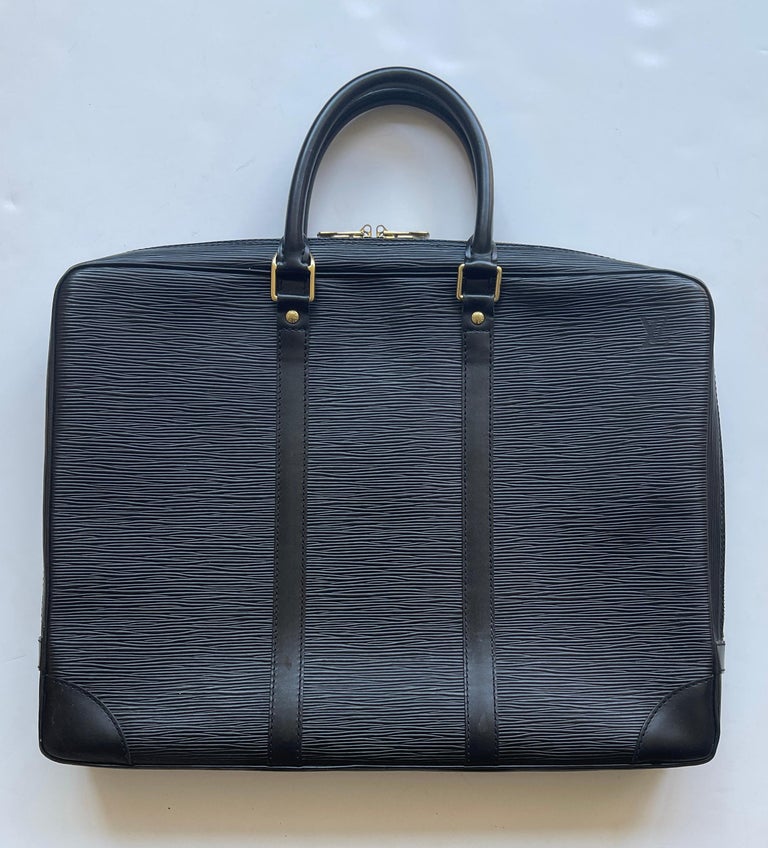 Louis Vuitton Black Epi Leather Porte-Documents Voyage Briefcase Bag

Made In: France
Year of Production: 1998
Color: Black
Hardware: Goldtone
Materials: Epi leather
Lining: Black leather
Closure/Opening: Zip
Interior Pockets: One zipper pocket,