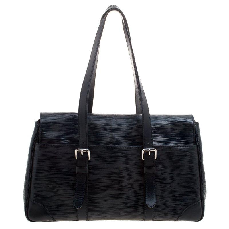 Louis Vuitton's handbags are popular owing to their high style and functionality. This Segur MM bag, like all the other handbags, is durable and stylish. Crafted from black epi leather, the bag can be paraded using the two top handles. It is