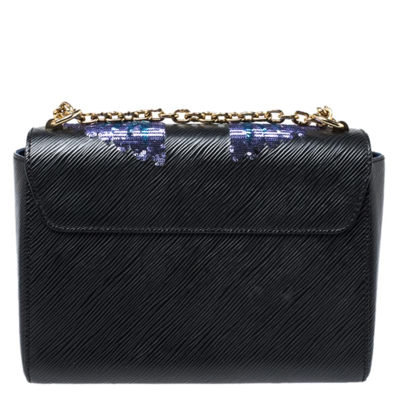 It is every woman's dream to own a Louis Vuitton handbag as appealing as this one. Crafted from Epi leather, this bag features a structured design with a chain link which can be used as crossbody or hung on the shoulder. While the sequin bird