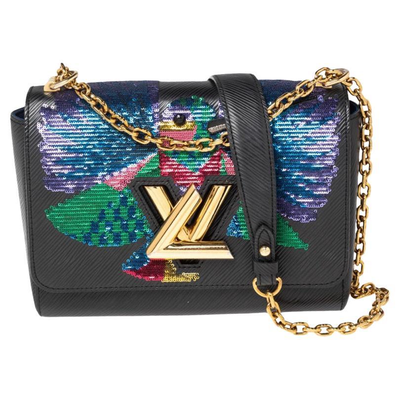 Louis Vuitton Sequin Monogram Bag. This tote features tall black leather  strap top handles and polished metal hardware including a gold toned plate  and zipper pull. Black sequins mimic the original LV