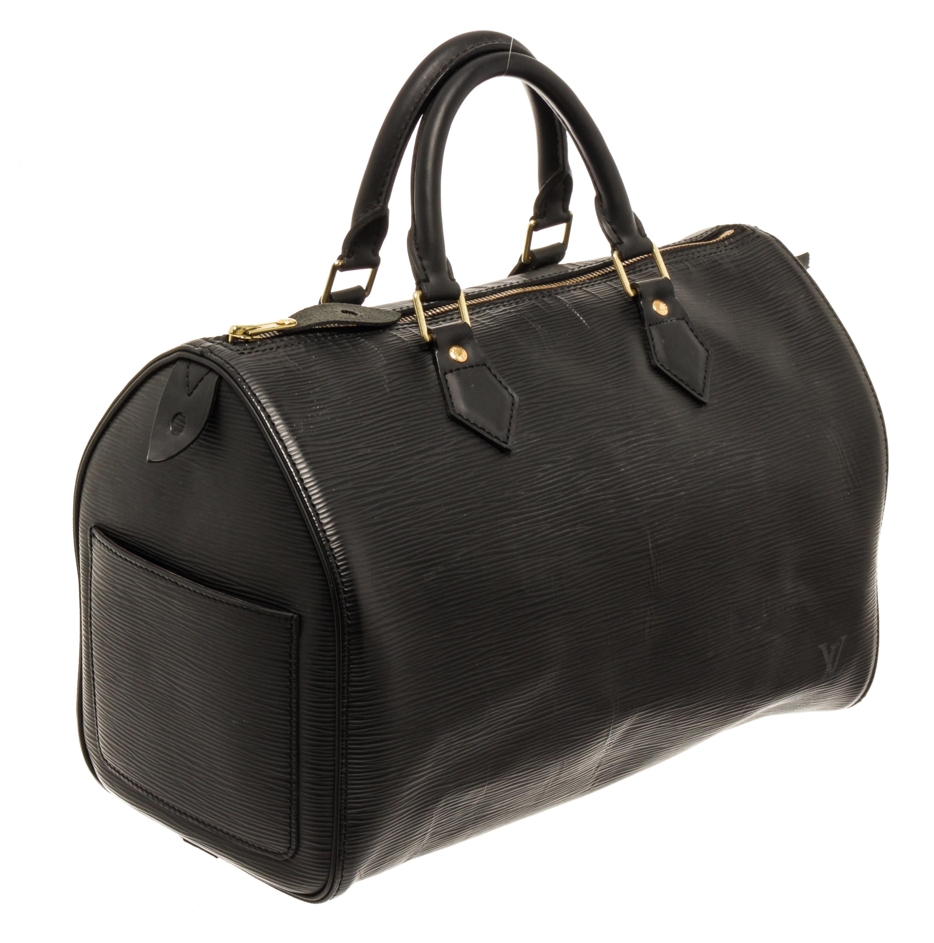 Louis Vuitton Black Epi Leather Speedy 30cm Satchel Bag with material epi leather, gold-tone hardware, trim tan vachetta leather, exterior patch pocket at the side, black canvas lining, dual rolled leather top handles and zipper closure.

76488MSC.