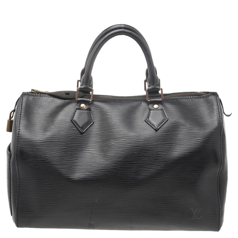 Titled as one of the greatest handbags in the history of luxury fashion, the Speedy from Louis Vuitton was first created for everyday use as a smaller version of their famous Keepall bag. This Speedy 35 comes crafted from Epi leather with two