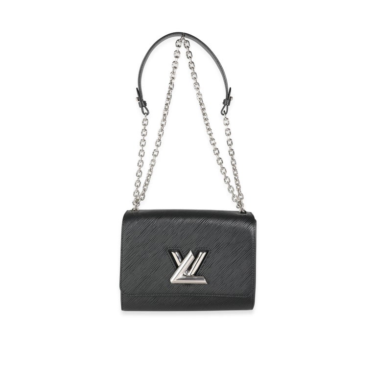 
Listing Title: Louis Vuitton Black Epi Leather Twist Chain MM
SKU: 116300
MSRP: USD 4,300.00
Condition: Pre-owned (3000)
Condition Description: The Louis Vuitton Twist Bag was first created for the 2015 Cruise show collection. Coming in the classic