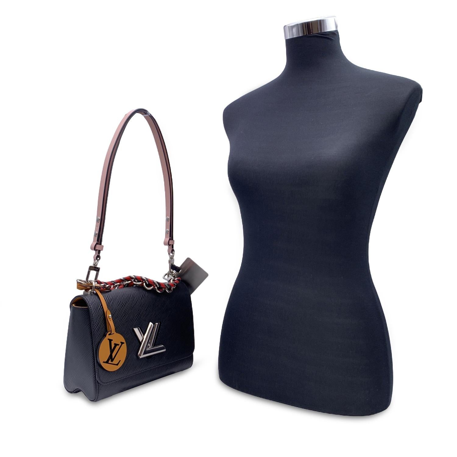 This beautiful Bag will come with a Certificate of Authenticity provided by Entrupy. The certificate will be provided at no further cost.

Elegant Louis Vuitton 'Twist MM' shoulder bag , crafted in black epi leather. Silver metal hardware. The Louis