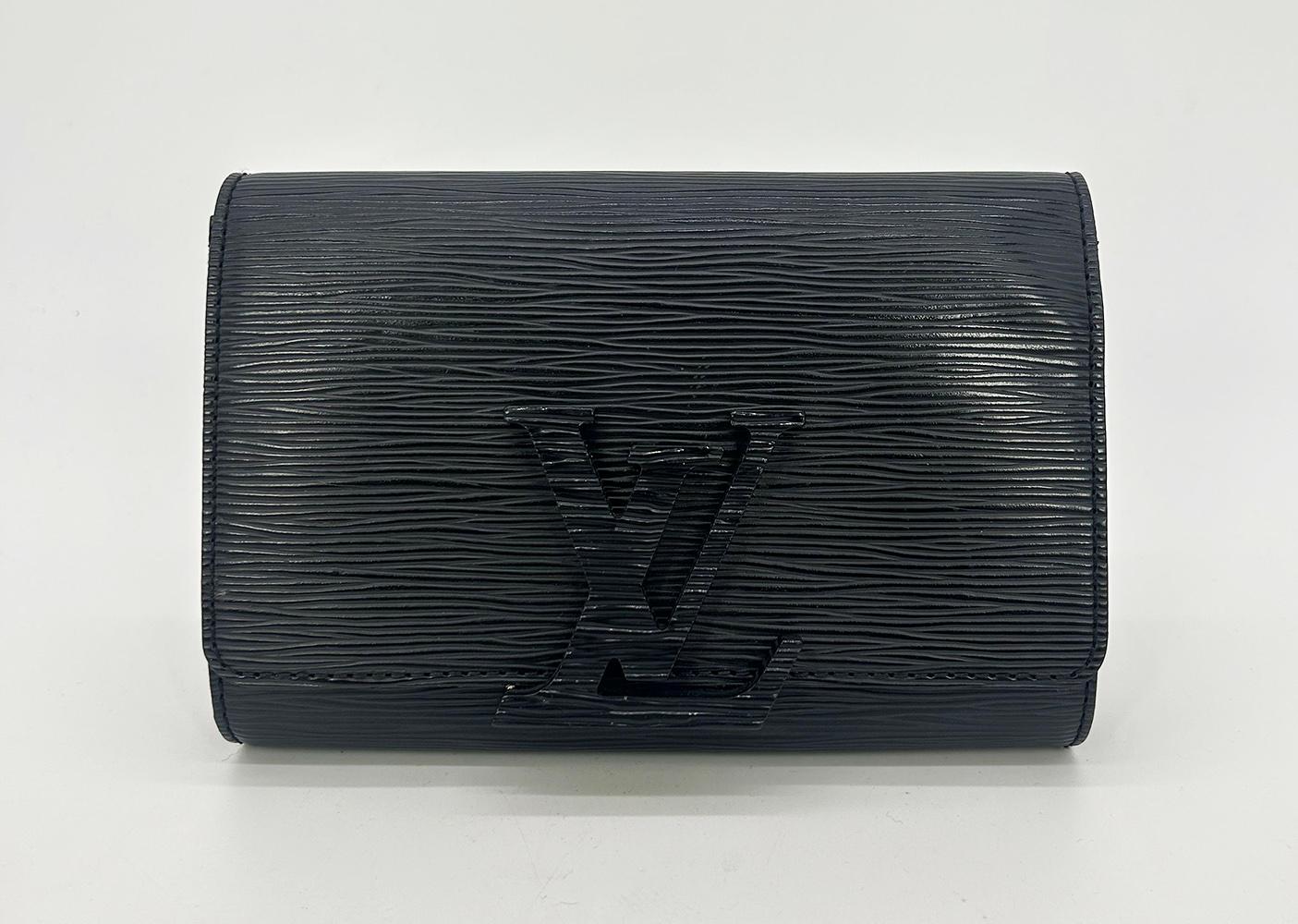 Louis Vuitton Louise Strap PM bag in good condition. Black electric noir epi leather exterior trimmed with silver hardware and mattching black epi LV logo centered hardware. Lift latch closure opens to a black suede interior with 2 slit and 1 zipped
