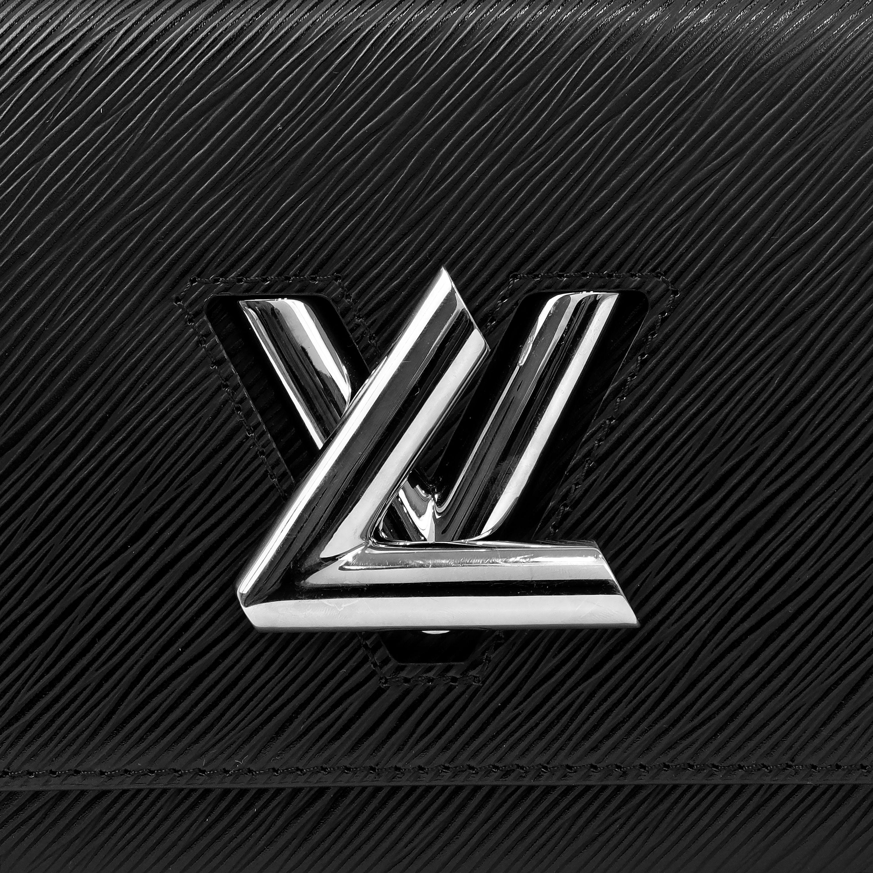 This authentic Louis Vuitton Black Epi Twist MM Crossbody Bag is in excellent plus condition.  Black Epi textured leather with silver signature LV Twist closure.  Original retail $4700.    Dust bag included. 

Measurements: 9