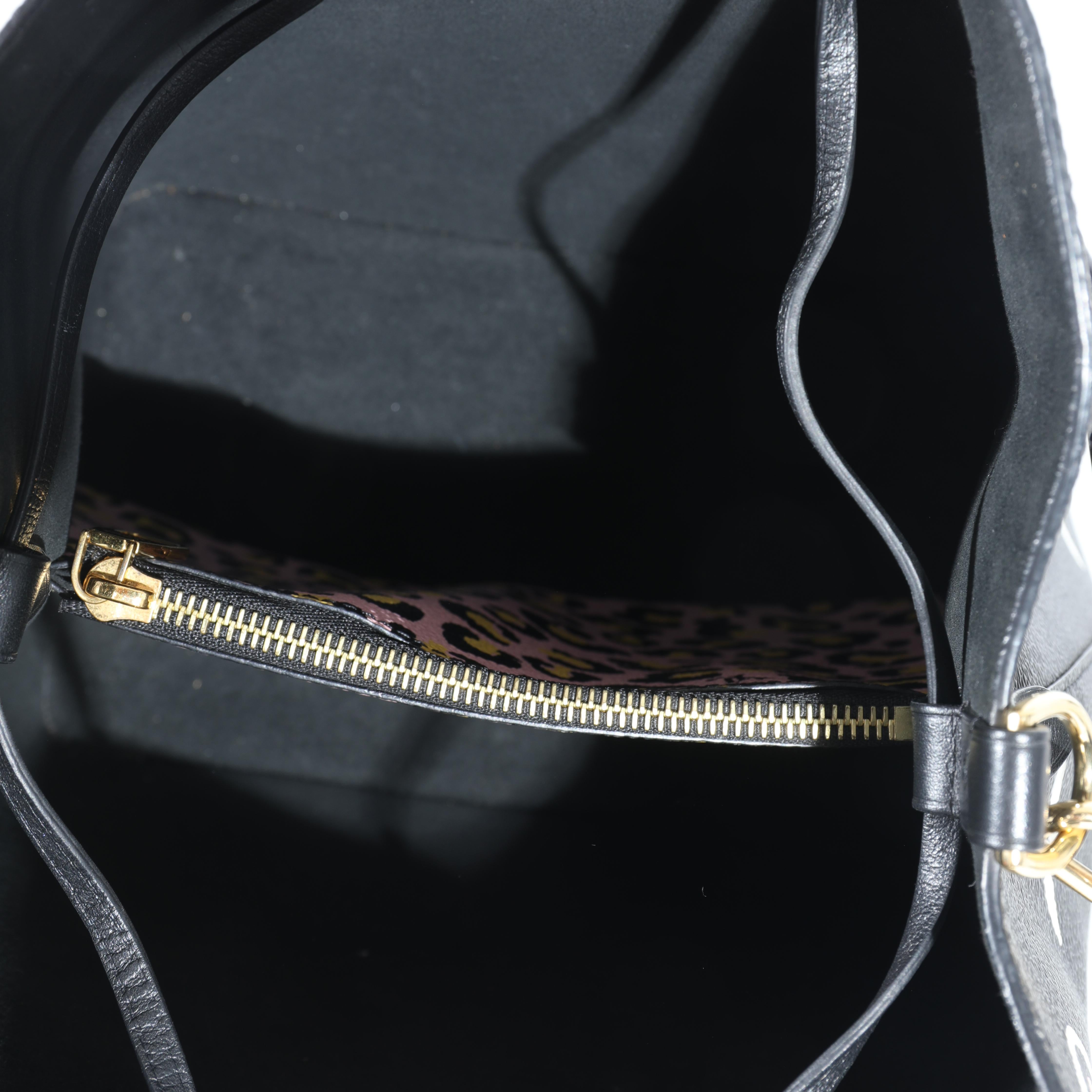 Listing Title: Louis Vuitton Black Giant Monogram Canvas Wild At Heart NeoNoe MM
SKU: 130804
Condition: Pre-owned 
Handbag Condition: Very Good
Condition Comments: Very Good Condition. Scuffing to corners. Scratching to hardware. Light discoloration