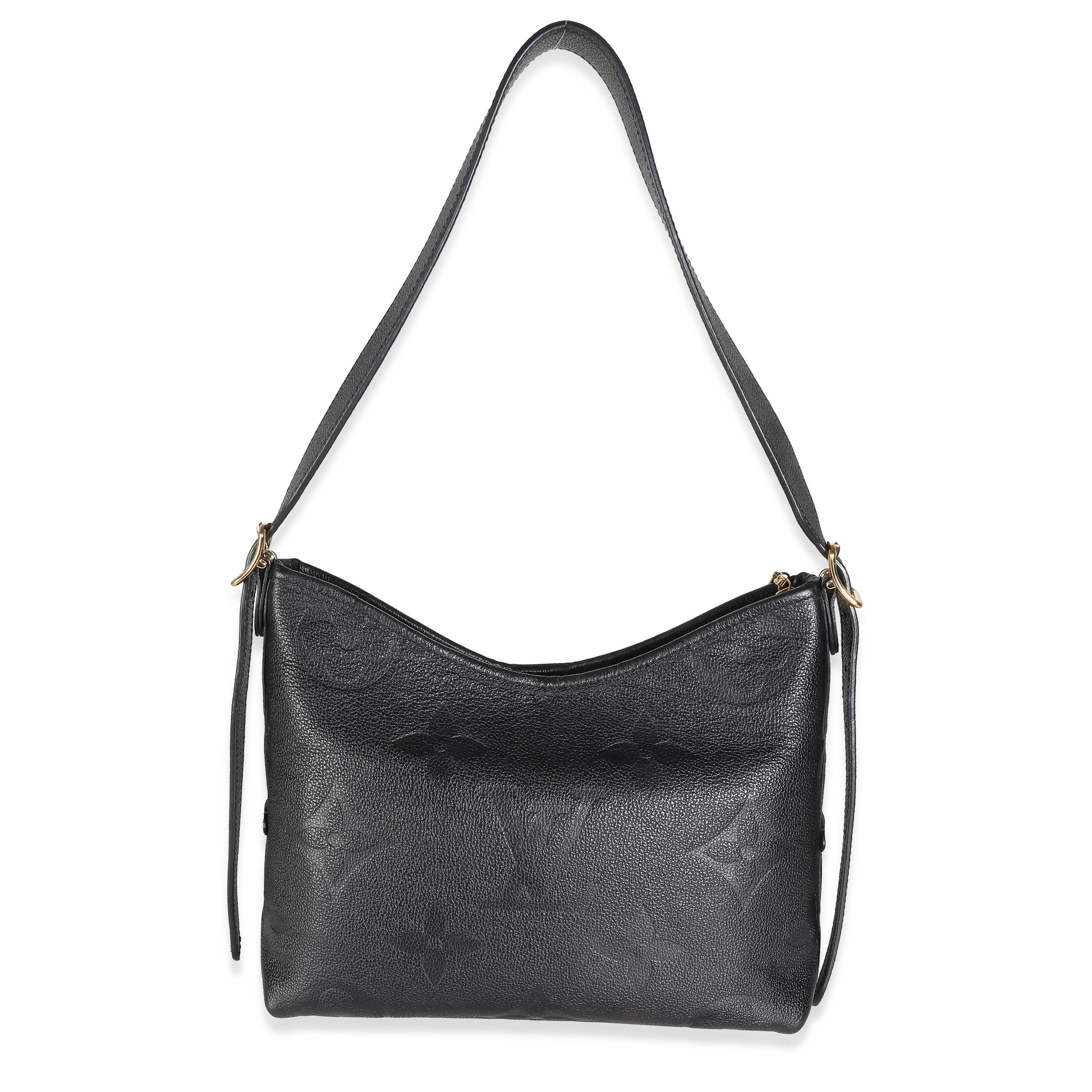 Listing Title: Louis Vuitton Black Giant Monogram Empreinte Carryall PM
SKU: 140318
MSRP: 3050.00 USD
Condition: Pre-owned 
Handbag Condition: Very Good
Condition Comments: Item is in very good condition with minor signs of wear.  Moderate corner
