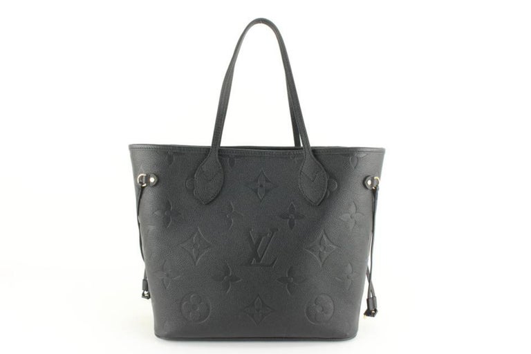 Louis Vuitton bag. Neverfull MM tote in Monogram Empreinte leather