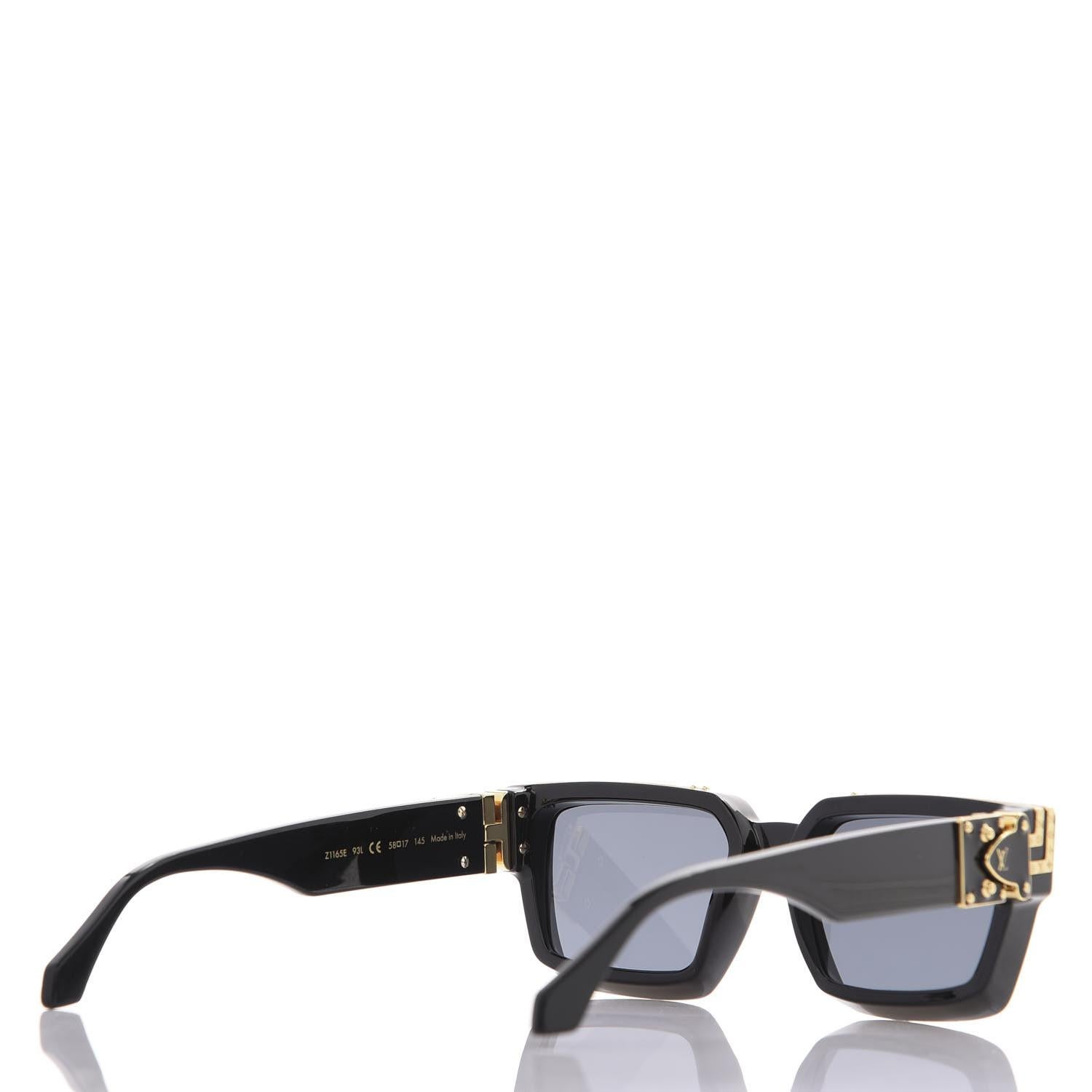 Noir Lunettes de soleil Louis Vuitton avec détails en or noir en vente