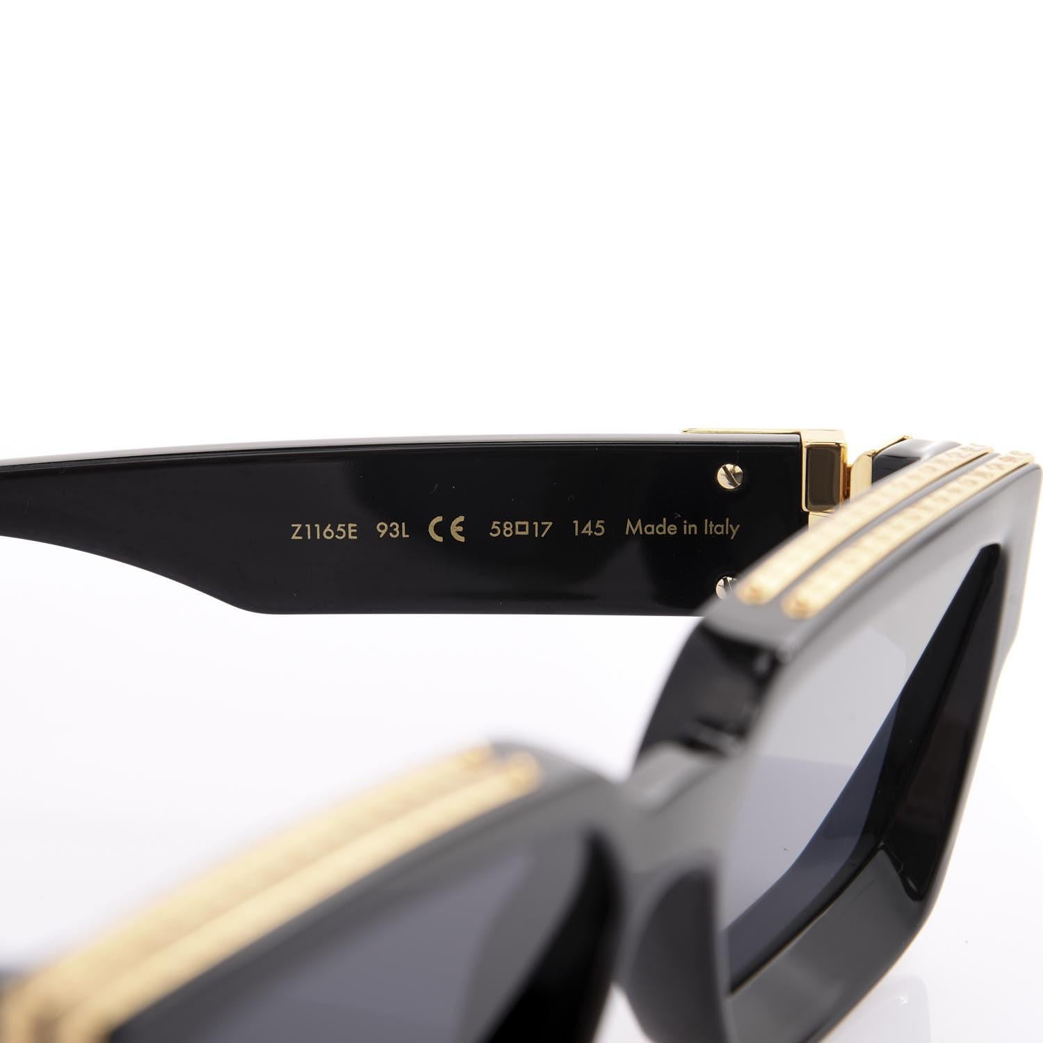 Lunettes de soleil Louis Vuitton avec détails en or noir en vente 1